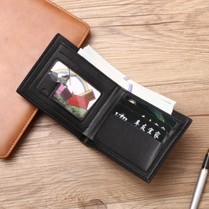 Slim black bi-fold leather wallet for men with multiple card slots and a photo window