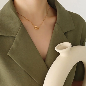 Interlocking double ring pendant necklace in 18K gold plated titanium steel for women