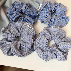Blue and white plaid fabric scrunchies set with minimalist checkered cotton texture