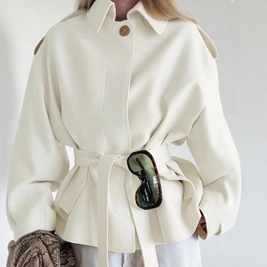 Elegant off-white short trench coat with lapel, waist belt, and premium relaxed fit