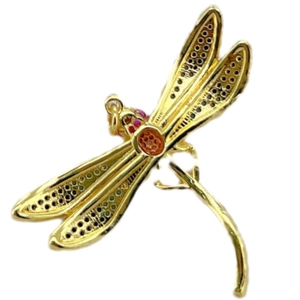 Back view of gold plated dragonfly pendant with textured wings and red zircon accents
