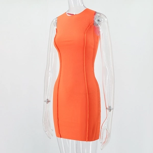 Detail of orange ribbed knit fabric with side seam stitching on a bodycon dress