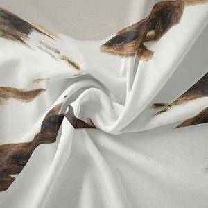 Close-up detail of Bohemian tapestry fabric showing artistic brown brushstroke patterns