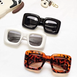 Kids square thick frame sunglasses in black, white, and leopard print arranged at 45 degrees