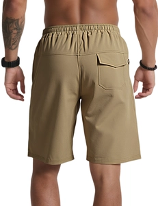 Detail view of khaki sports shorts showing elastic waistband and back flap pocket