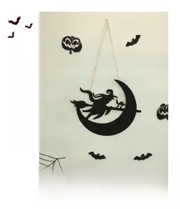 Detail of black metal Halloween hanging decor with witch, cat, and spooky wall ornaments