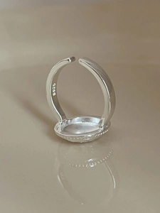 Macro view of S925 sterling silver stamp on the inner band of the adjustable ring