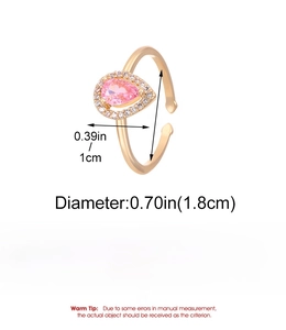 Macro view of adjustable copper ring with pink pear-cut zircon and size measurements