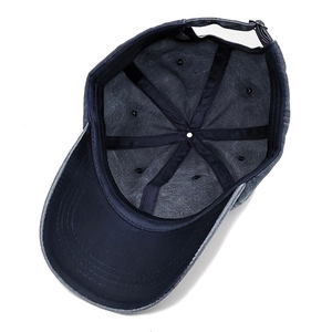 Inside view of navy washed cotton baseball cap with sweatband and adjustable metal buckle