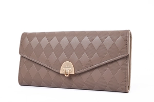 Detail view of a taupe quilted leather wallet with diamond patterns and a metal clasp