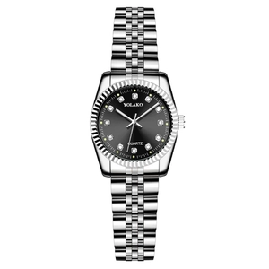 Detail of silver stainless steel watch with black dial and diamond hour markers