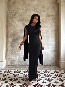 Elegant black backless evening dress with a round neck and flowing cape detail