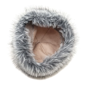 Detailed view of winter faux fox fur hat with soft plush exterior and warm suede lining