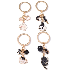 Cute enamel keychains set featuring cartoon black cat, poodle, and celestial heart charms