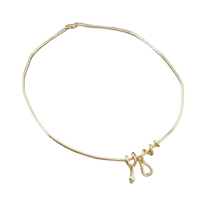 Elegant gold-plated snake pendant necklace featuring a minimalist snake bone chain design