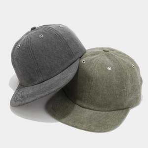 Retro short-brim baseball cap in grey and olive green cotton canvas showing side metal vents