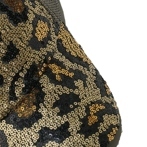 Macro detail of leopard print gold and black sequins on a breathable baseball cap