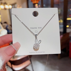 Rotating rabbit pendant necklace in silver with sparkling zircons and fine chain