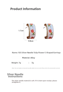 Detail view of Tulip C-shape earrings with 925 silver needles and white glaze finish