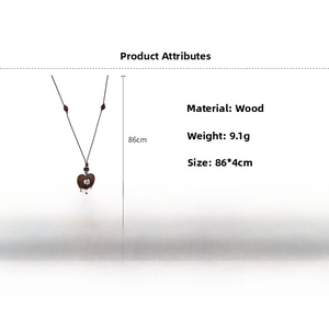 Detail of wooden heart pendant with metal inlay on adjustable long wax cord necklace