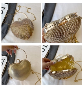Detailed views of gold heart evening bag with crystal rhinestones and chain strap