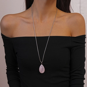 Minimalist long necklace featuring a teardrop-shaped pink natural stone pendant on silver chain