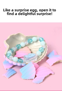 Kids beaded bracelet with acrylic cat charm inside a broken pastel surprise egg shell