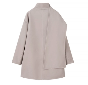 Back view of a taupe wool coat featuring a unique asymmetrical scarf detail design