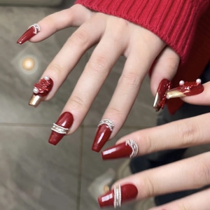 Red coffin press-on nails with bridal design, pearl accents and 3D Xi character