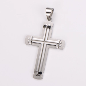 Detail of layered two-tone stainless steel cross pendant with polished and brushed finish