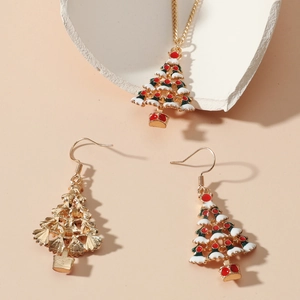 Close-up of golden Christmas tree jewelry set with colorful enamel earrings and necklace
