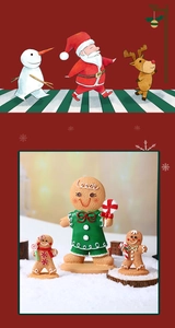 Macro detail of resin gingerbread man figurines with cookie texture in a snow scene