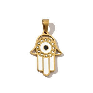 Close-up of golden Hamsa hand pendant with evil eye motif and sparkling crystals
