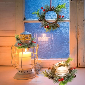 Mini Christmas wreath candle ring with artificial pine needles, red berries and pine cones