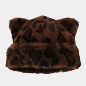 Macro detail of the thick leopard print faux fur texture and cute fox ears on the hat
