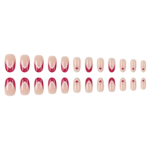 Almond press-on nails set with red French tips and heart patterns on nude base