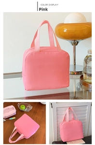Detailed view of pink insulated kids lunch bag featuring dual handles and zipper closure