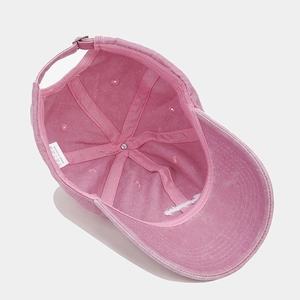 Pink washed cotton baseball cap with vintage embroidery and adjustable metal buckle strap