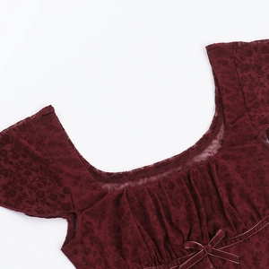 Detail of square neckline with lace floral texture and bow on burgundy slim t-shirt