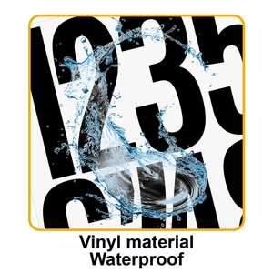 Macro shot of waterproof vinyl material showing dynamic water splashes on large black letters