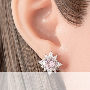 Detailed close-up of flower stud earring with S925 silver needle and silicone backing