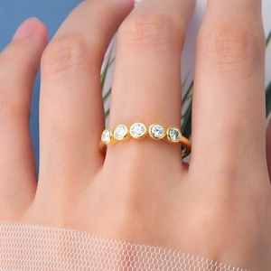 Close-up of elegant gold plated S925 silver ring with five round brilliant cut zircons