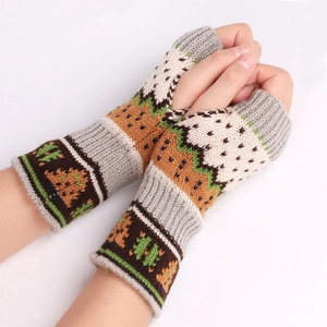 Close-up of thick knitted fingerless gloves with colorful ethnic jacquard patterns
