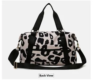 Back view of travel bag featuring cow print pattern and functional zipper pocket