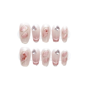 Pink cat eye press-on nails with golden wire and floral butterfly rhinestone accents