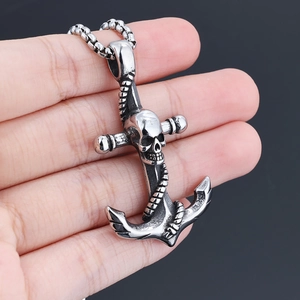 Detail view of gothic anchor pendant with skull motif on a silver bead chain