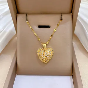 Luxurious gold double-layered broken heart pendant necklace with shimmering white crystals