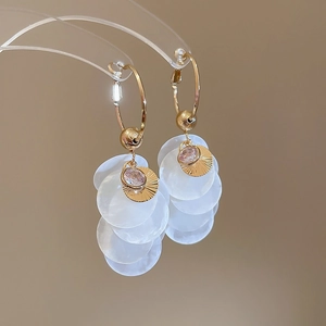Gold earrings with pink zircon sunburst and layered white shell petals