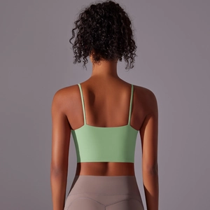 Back view of green sports bra showing thin straps and sleek athletic back design
