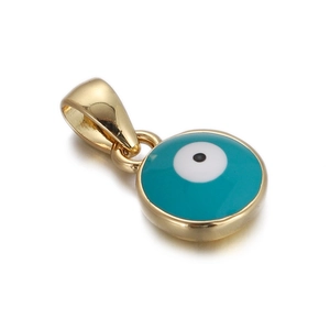 Macro detail of gold-plated evil eye pendant with turquoise enamel inlay for jewelry making